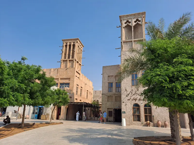 Wind towers and a palm in the Al Fahidi (Bastakiya) heritage quarter